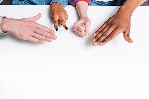 A diverse hand reaching out to another in support, symbolizing solidarity and the process of filing a discrimination complaint with the EEOC.