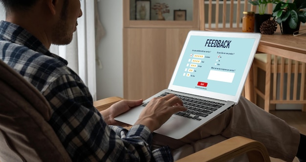 A hand pointing and clicking on a survey website displayed on a laptop screen with magazines around. The layout is clean and focused, with a call to action emphasizing the surveys for points of free magazines subscriptions.