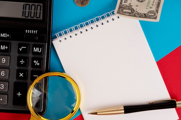 A close-up of a tax form with a calculator and financial documents in the background, representing the preparation needed for claiming the Child Tax Credit. The scene is set on a clean, organized desk.