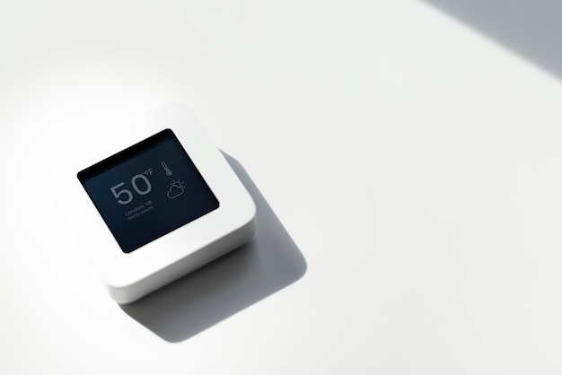 A close-up of a smart thermostat set to an energy-saving temperature, emphasizing the importance of energy management.