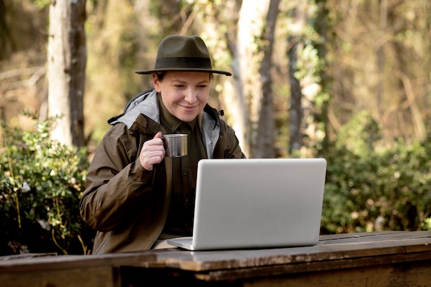A person using a laptop to search for state-specific government assistance programs. The atmosphere is calm and focused, with the individual appearing determined to find the help they need. The laptop screen displays a state government website with a clear, user-friendly interface.