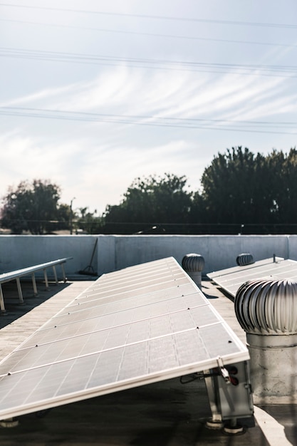 A close-up shot of a solar panel installation on a residential roof, with tools and equipment visible, emphasizing the investment in renewable energy.