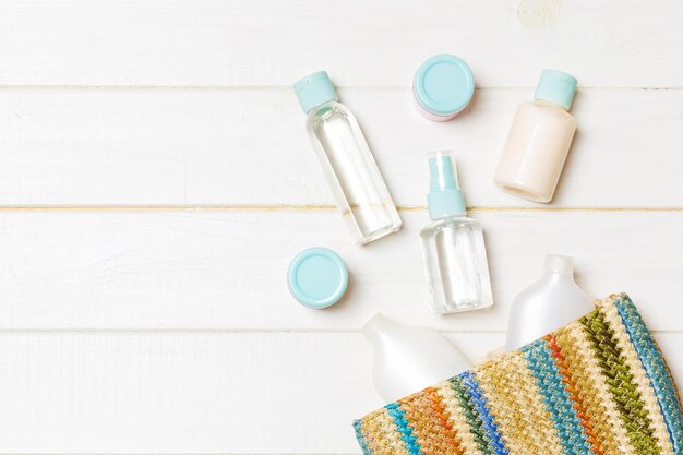 Close-up of various baby product samples like diaper cream, lotion, and small diaper packs arranged neatly on a changing table.