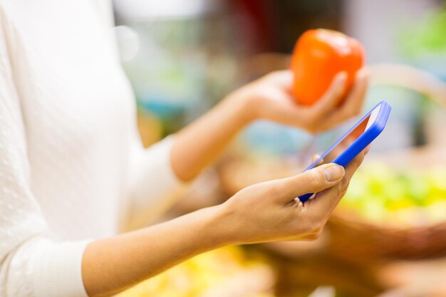 A close-up shot of an EBT card being used at a grocery store checkout, highlighting the practical application of SNAP benefits.