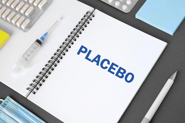 A close-up shot of an application form with the Medicaid logo, a pen resting on top. The form has various sections highlighting income, household members, and health conditions.